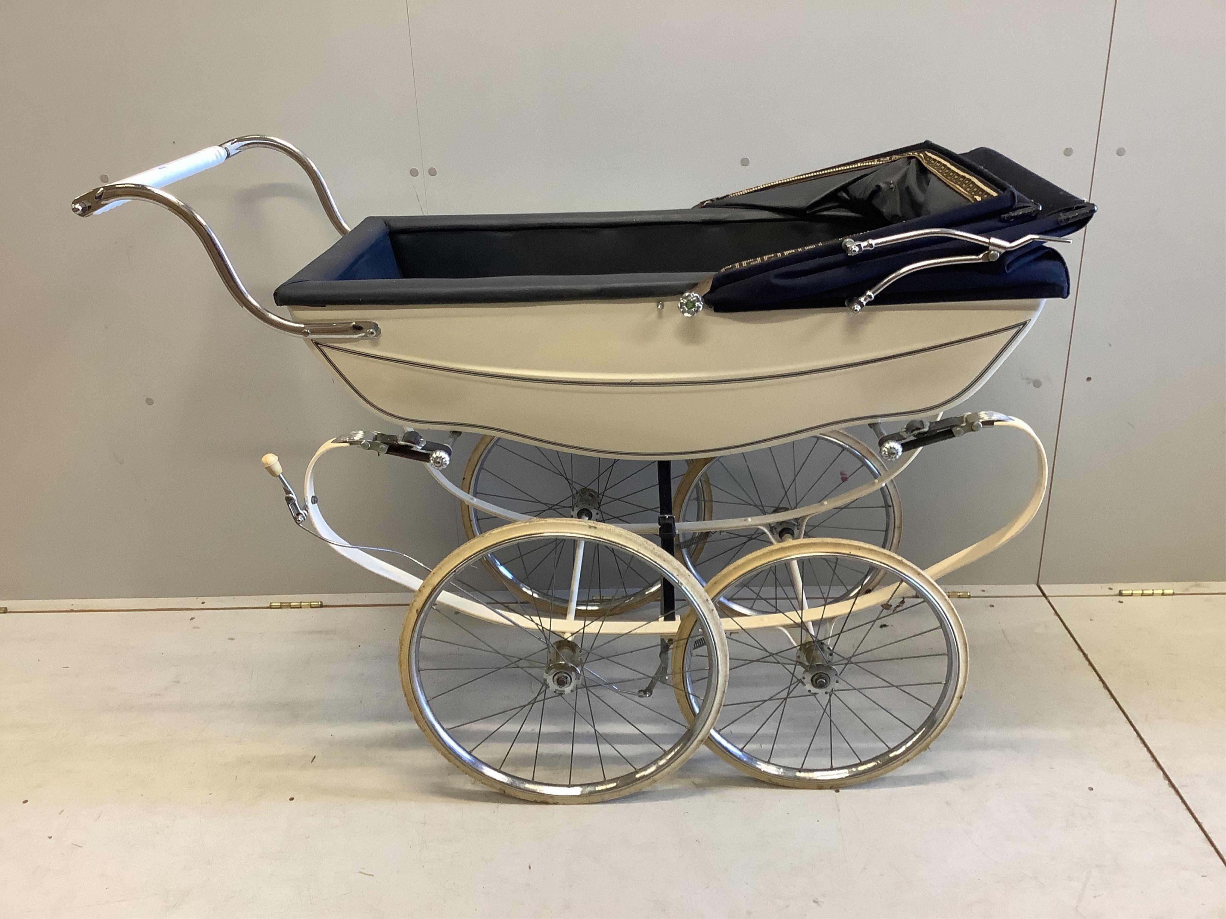 A vintage Silver Cross pram, height 122cm. Condition - fair